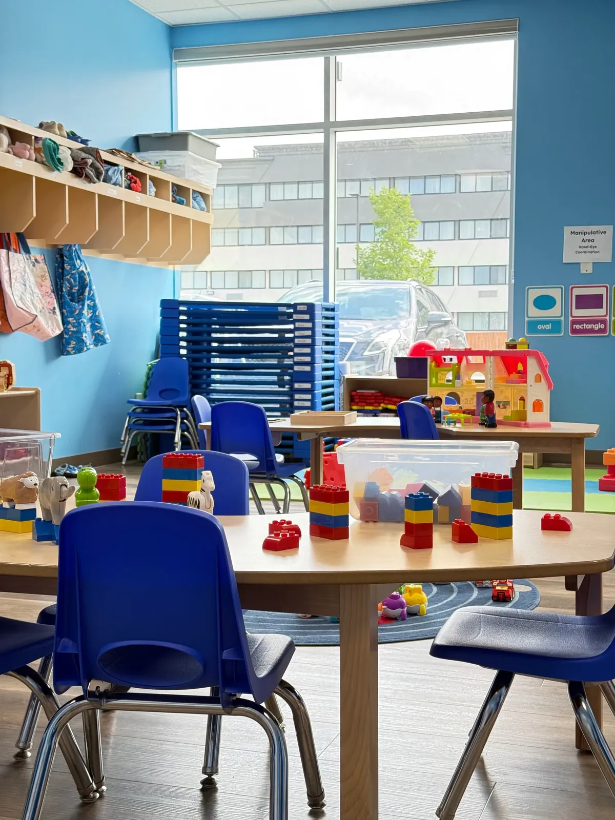 Building blocks and toy animals on a child-sized table